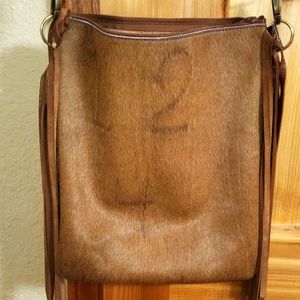 Branded cowhide and embossed leather crossbody